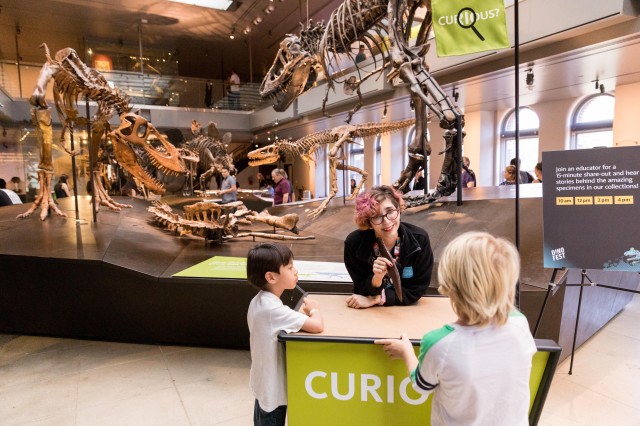 Guests at the curiosity cart in dino hall