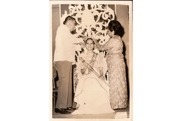 Woman being crowned in pageant 