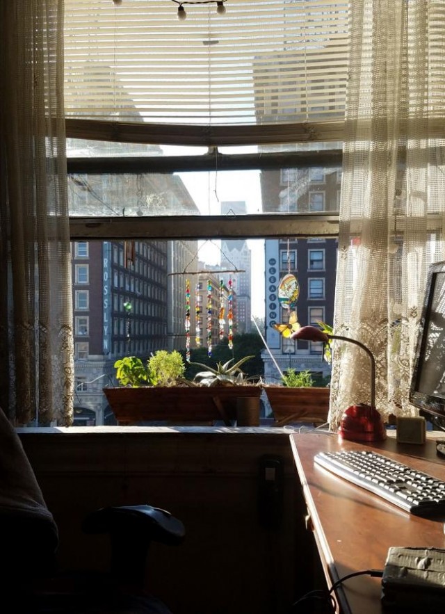 view from inside the apartment, looking out the window into downtown