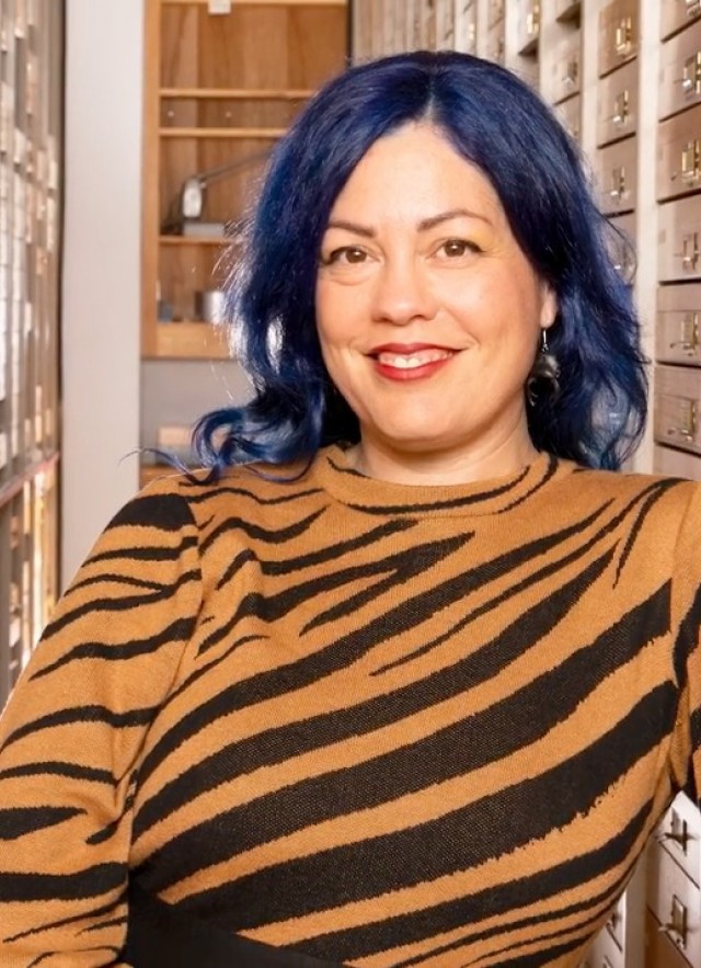 Lisa Gonzalez portrait in Entomology Collections room