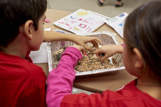 Image of two kids mixing simulated matrix in an aluminum tray