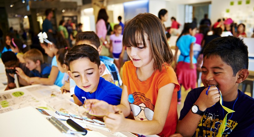 kids interacting with exhibits in nature lab